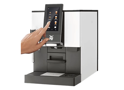 Der Kaffeevollautomat für Unternehmen WMF 1100S in der Seitenansicht.