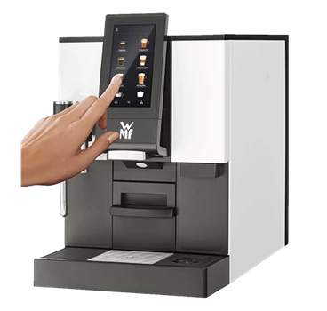Der Kaffeevollautomat für Unternehmen WMF 1100S in der Seitenansicht.