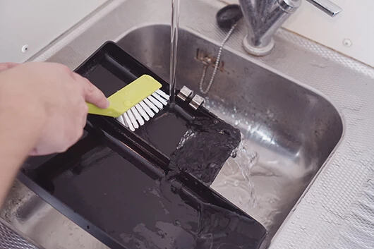 Tropfschale der Cafitesse Excellence Compact Touch reinigen.